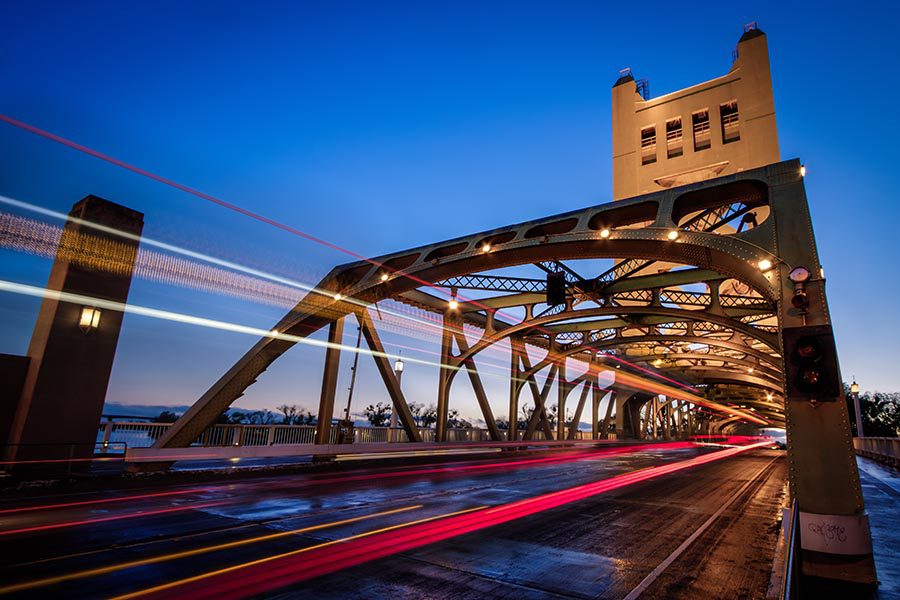 About Our Agency - Time Lapse Traffic Over the Tower Bridge in Sacramento, California at Dusk